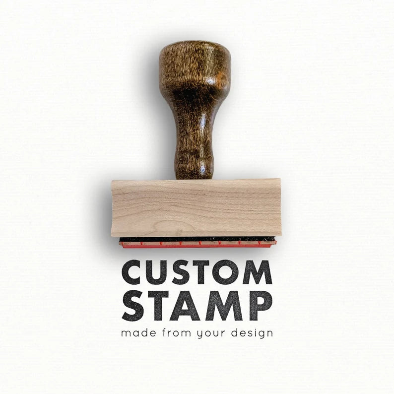 Custom rubber stamp with wooden handle, designed to feature personalized designs for documents and crafts.