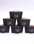 Custom Cup Sleeves stacked showcasing black design with the logo for Elle Café, ideal for branding takeaway drinks.
