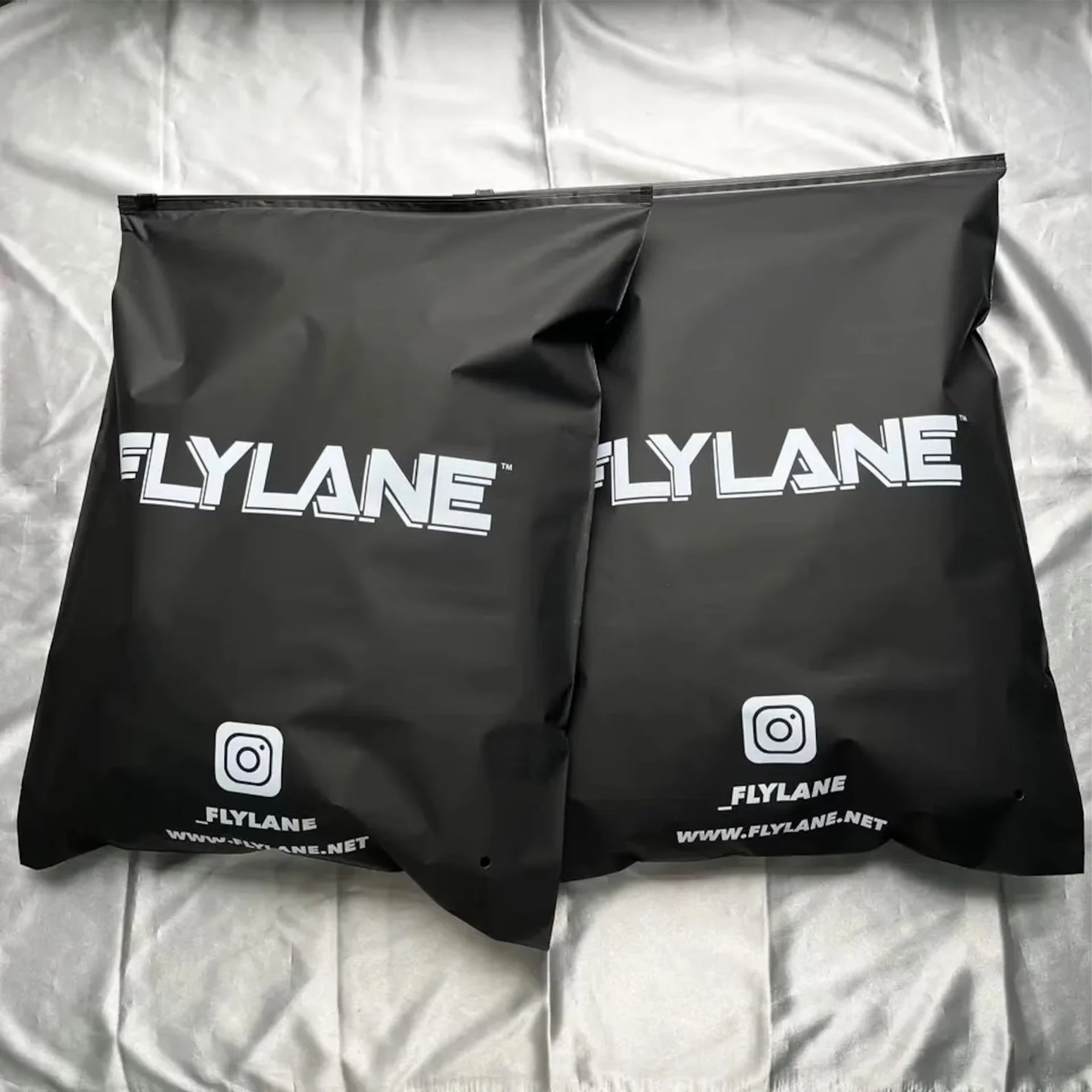 Custom black zipper bags by Flylane, designed for premium packaging and secure closure.