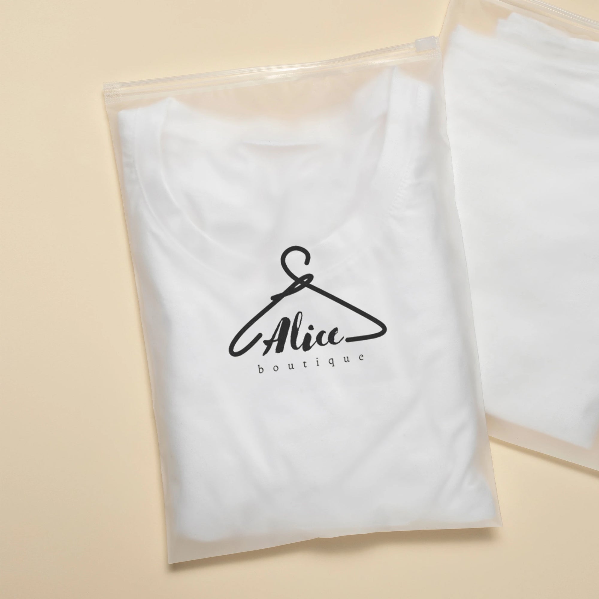 Custom frosted zipper bag containing a white t-shirt with Alice Boutique logo, ideal for stylish packaging.