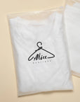 Custom frosted zipper bag containing a white t-shirt with Alice Boutique logo, ideal for stylish packaging.