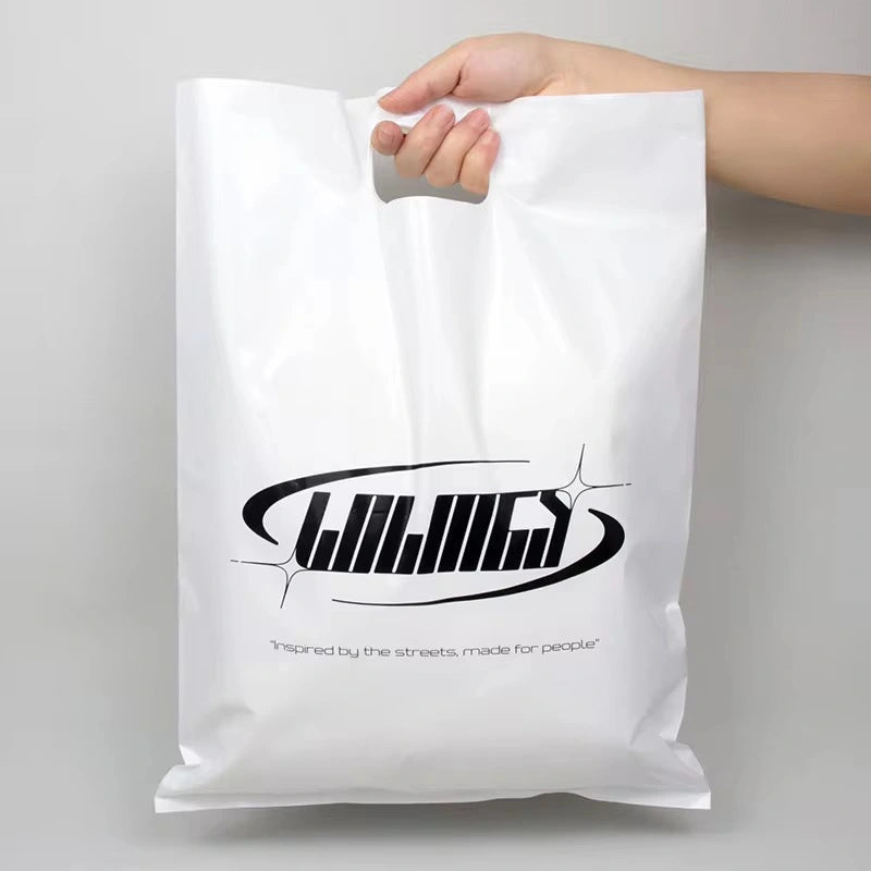 White custom die cut handle bag featuring graphic logo design for branding and promotion.