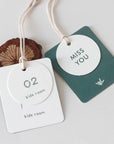 Custom hang tags for kids room with playful designs and messages, enhancing product presentation.