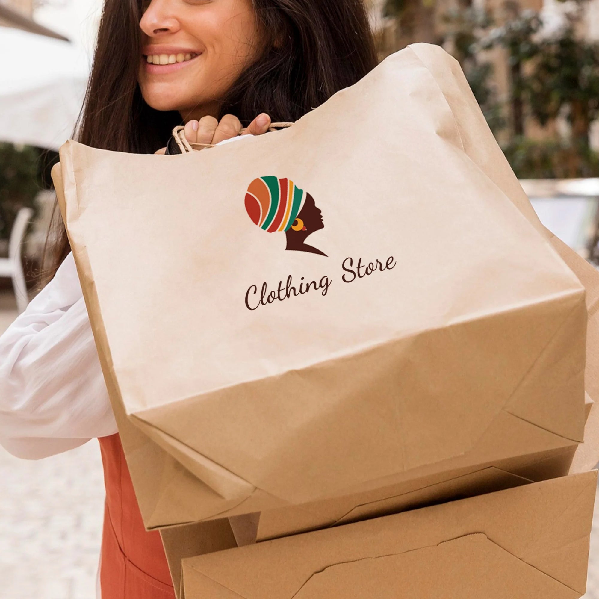 Woman smiling while carrying custom paper bags for a clothing store, showcasing eco-friendly branding.