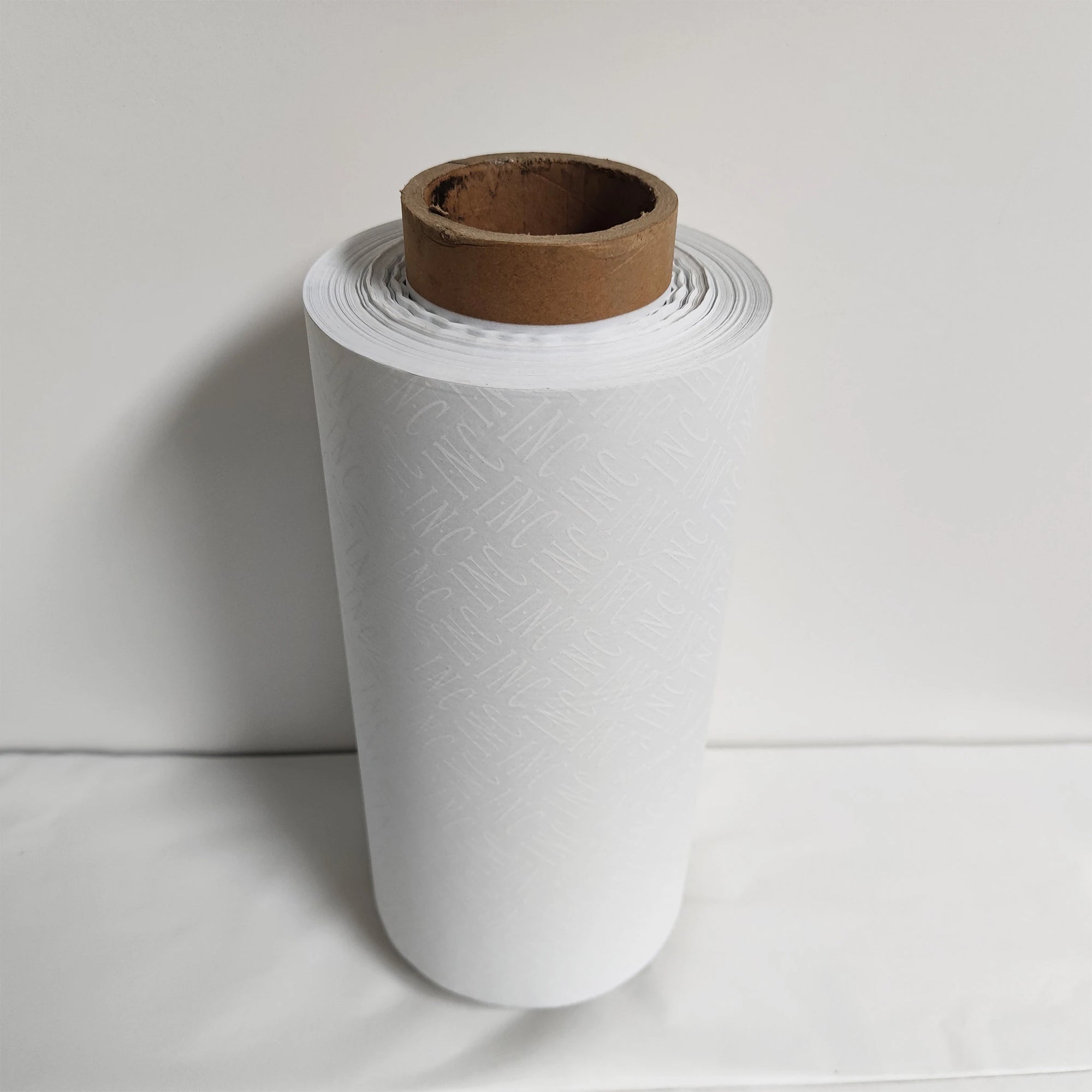 Custom tissue paper roll in white, eco-friendly and luxurious, perfect for branding and packaging.