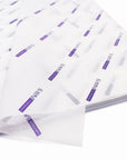 Custom tissue paper featuring elegant branding design in purple, perfect for enhancing product presentation.