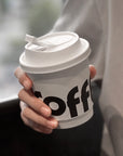 Custom Paper Cups showcasing a branded coffee cup held by a person, perfect for cafes and events.