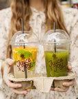 Custom Plastic Cups filled with colorful juices, ideal for branding at cafés and beverage businesses.