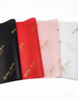 Custom tissue paper in black, red, pink, and white with gold "ROSE BOX" branding. Enhance your packaging elegance.