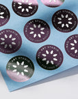Custom round stickers featuring "Nail Art Studio" logo design on a blue background. Perfect for branding and promotional needs.