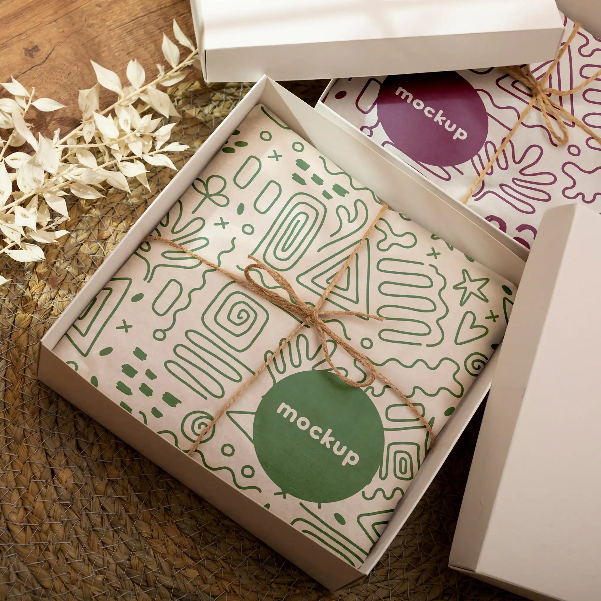 Custom round stickers displayed on gift wrap in a stylish box, showcasing branding and packaging design.