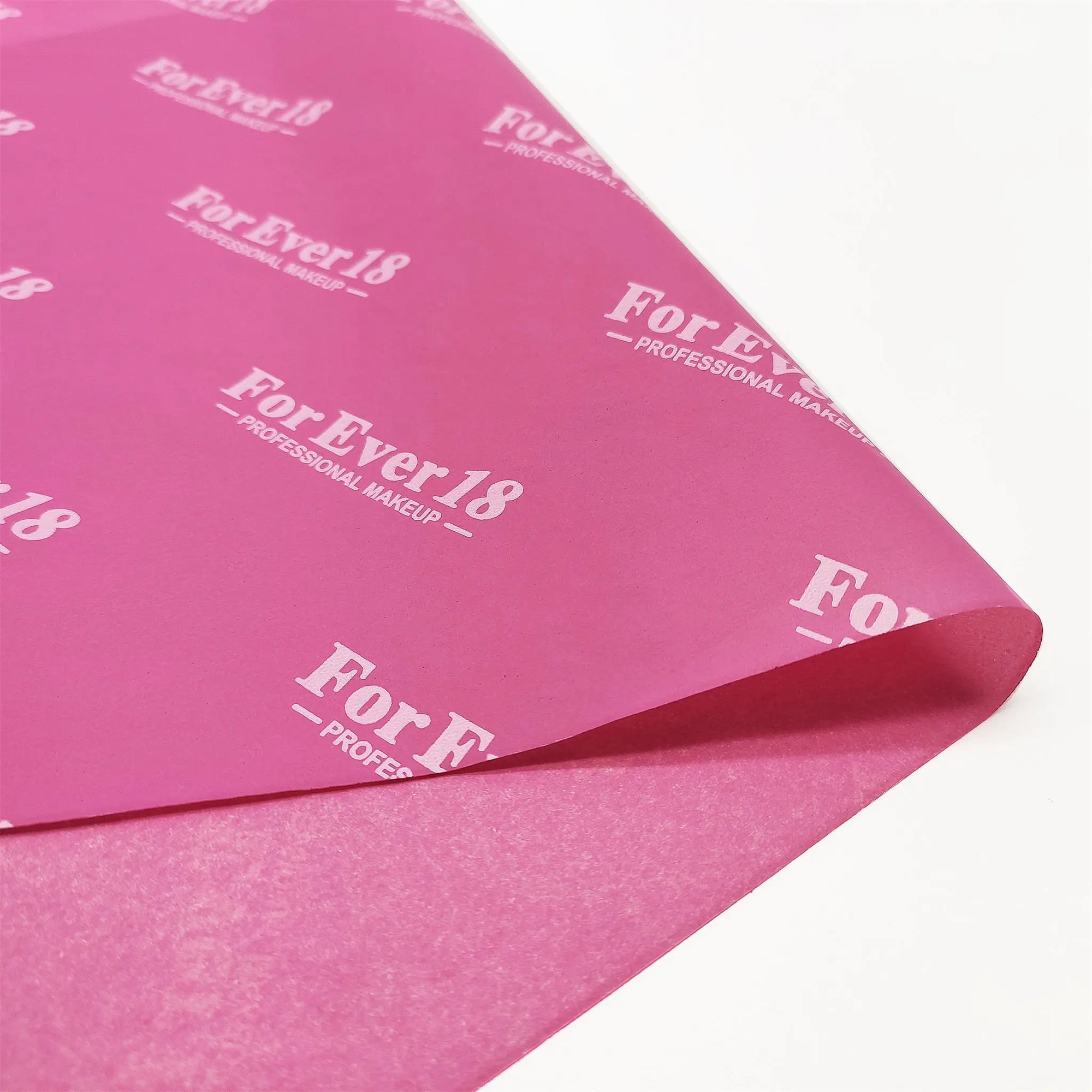 Custom pink tissue paper featuring For Ever18 logo, ideal for enhancing packaging and branding for makeup products.