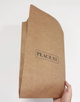 Custom Kraft Mailer made from eco-friendly recyclable kraft paper with 'PEACE ST.' imprint.