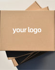 Custom mailer box featuring a logo on a kraft surface, ideal for branding and packaging solutions.