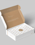 Custom mailer box in open position with a thank you note and elegant interior design ready for packaging.