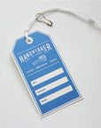 Blue custom hang tag with space for details like color and size, ideal for showcasing products.