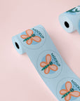 Custom round roll labels featuring colorful designs, including a butterfly and a sea creature on a pastel background.