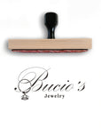 Custom rubber stamp featuring Bucio's Jewelry logo for branding and personalization.
