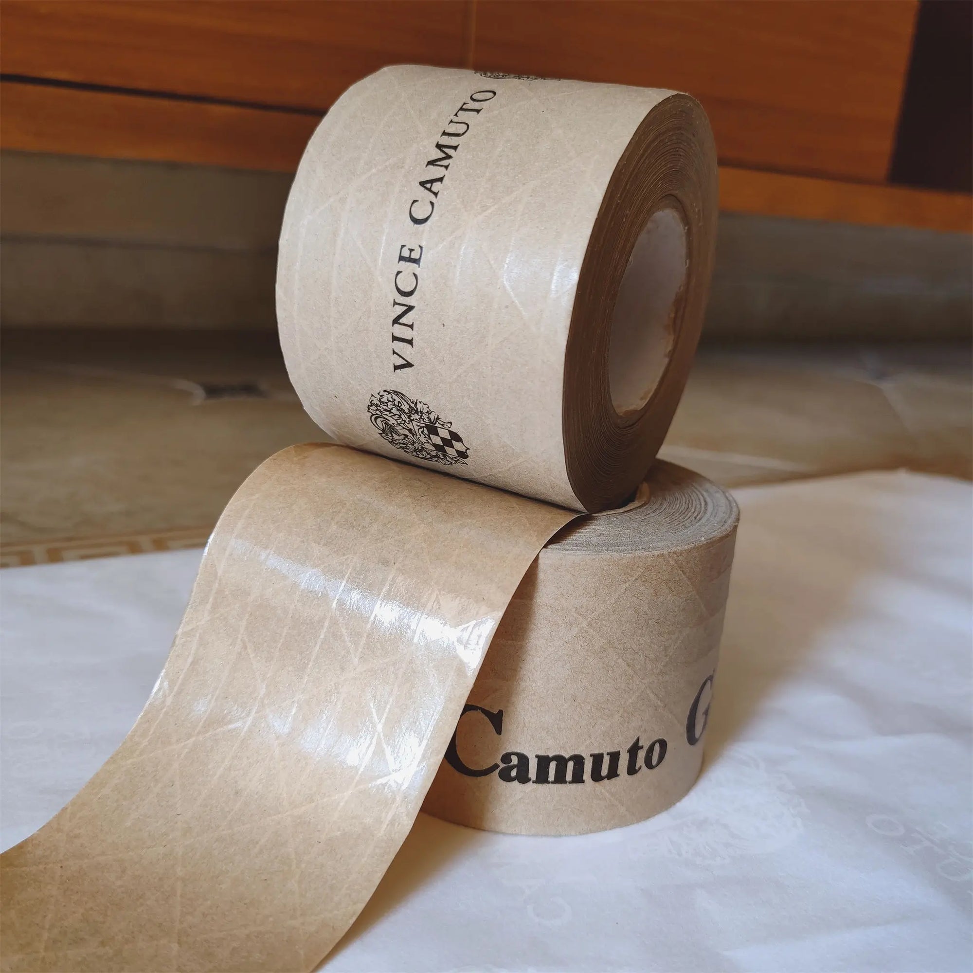 Custom water-activated tape rolls with branding, showcasing durability and sealing power for secure packaging.