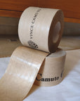 Custom water-activated tape rolls with branding, showcasing durability and sealing power for secure packaging.