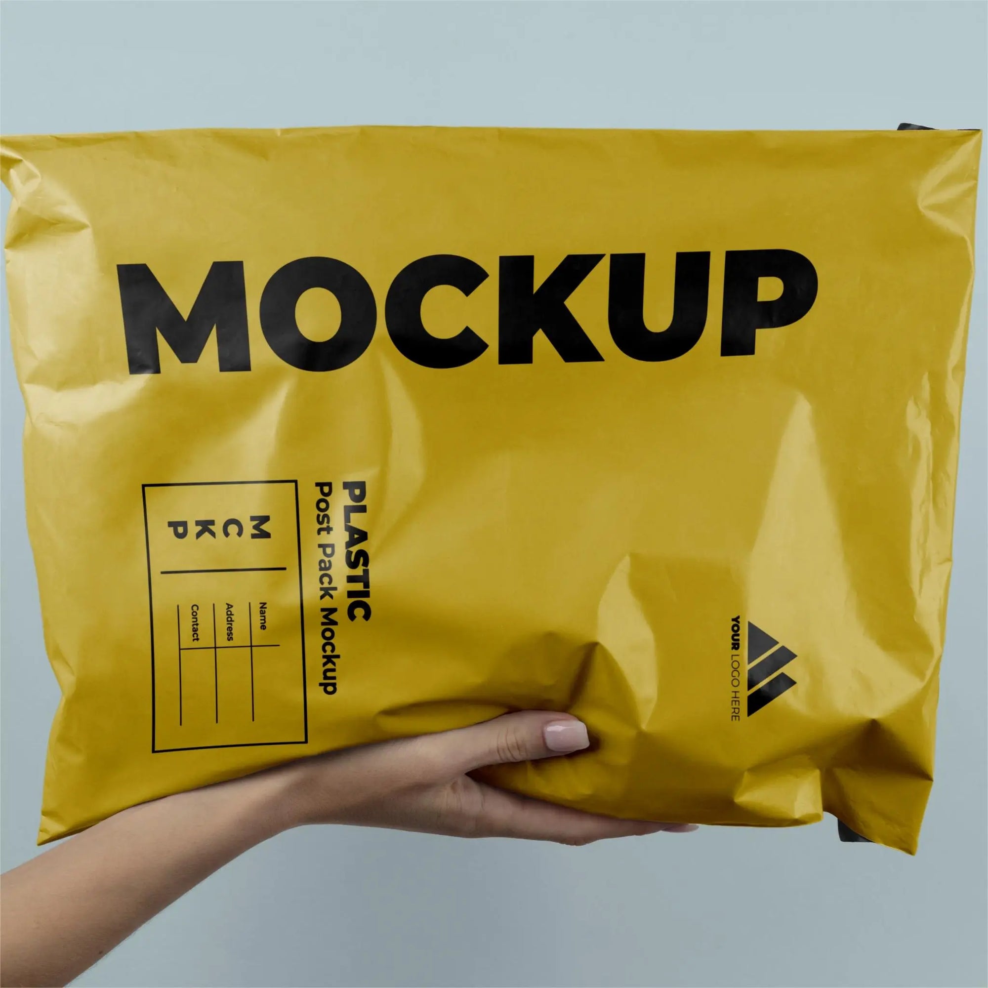 Mockup of a yellow custom poly mailer being held, showcasing eco-friendly packaging design for branding.
