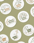 Custom round stickers featuring playful animal designs and text placeholders on a green background.