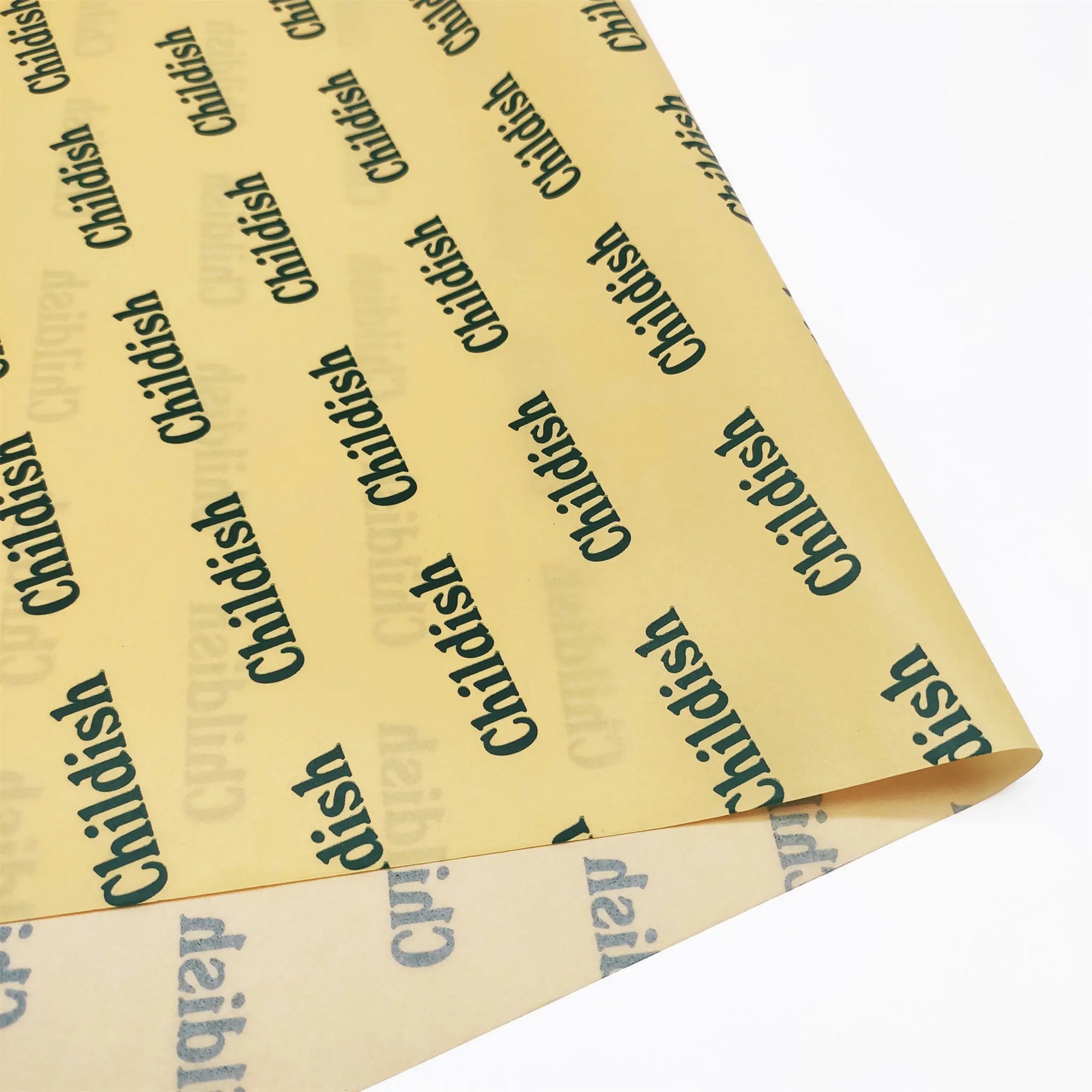 designed yellow tissue paper with green logo