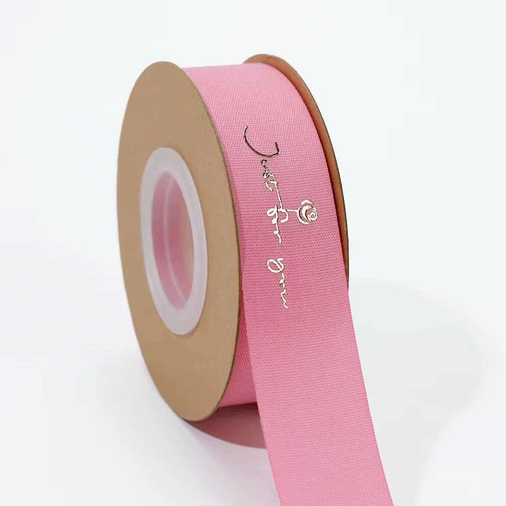 Custom pink cotton ribbon with "Just for You" in elegant script, perfect for packaging and special events.
