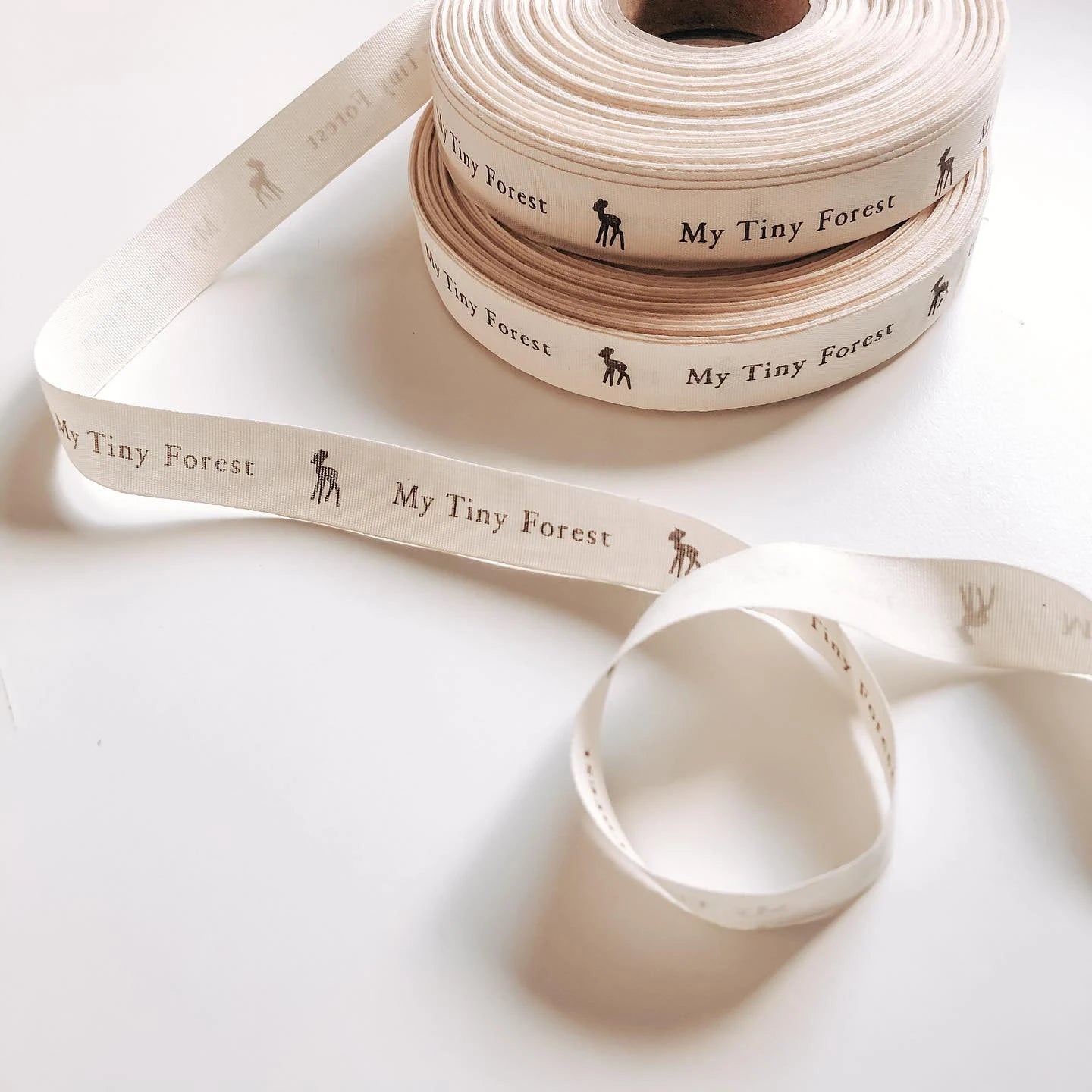 Custom cotton ribbon in natural tones with "My Tiny Forest" text and graphic, perfect for sustainable packaging and crafts.