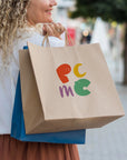 Woman holding custom paper bags with colorful logo, showcasing eco-friendly and stylish design for branding.