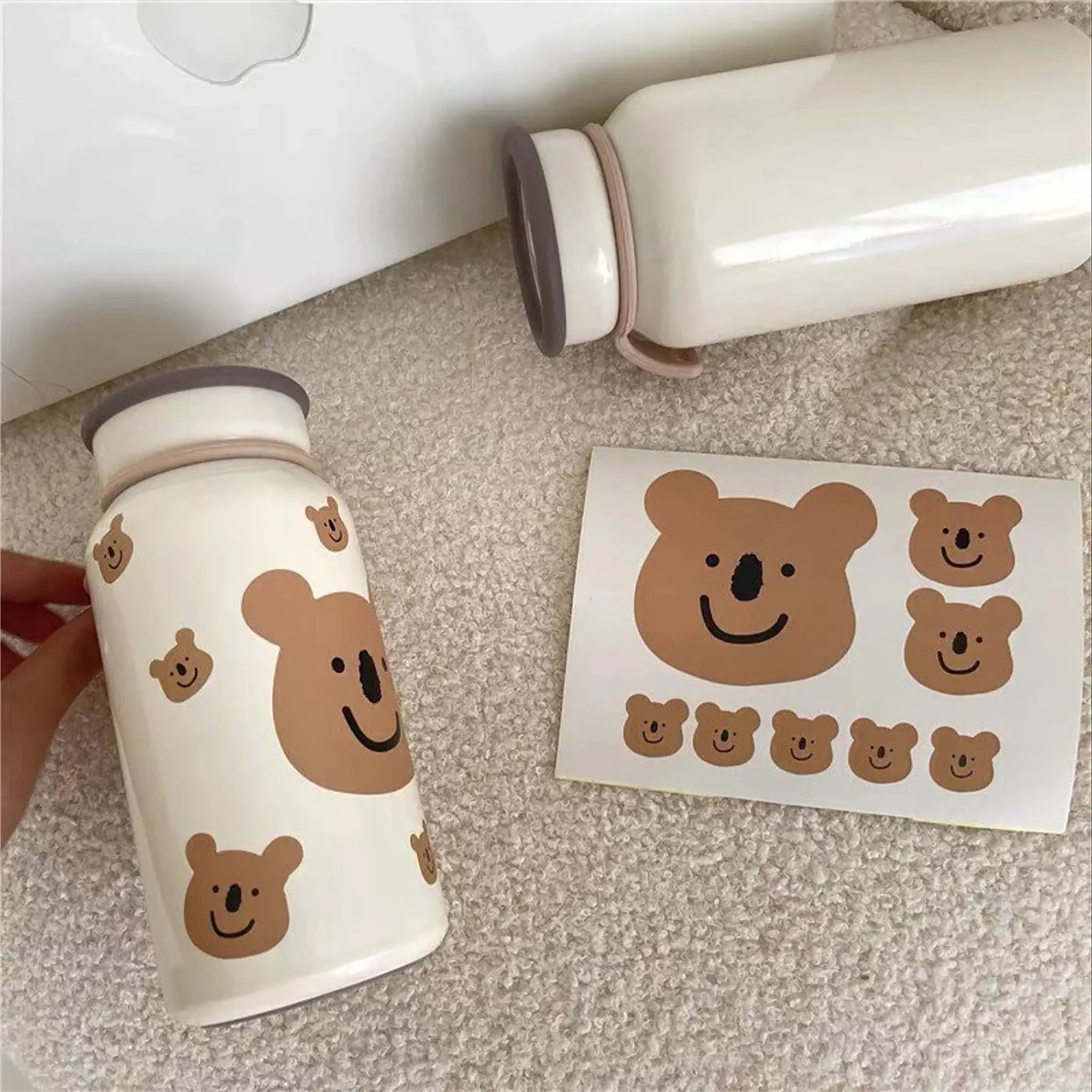 Custom bear-themed stickers and a matching bottle, showcasing cute bear designs for playful branding.