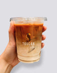 Custom Plastic Cups featuring iced coffee in a durable food-grade cup with a logo.