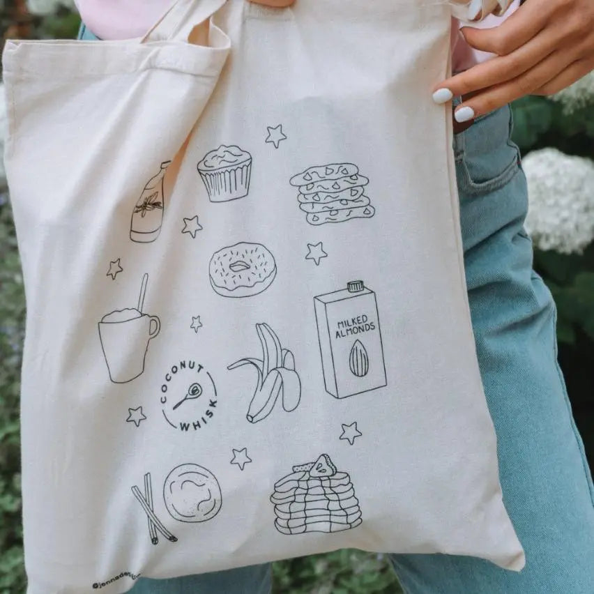 Custom tote bag featuring fun food illustrations, showcasing style and eco-friendliness for everyday use.