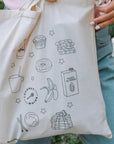 Custom tote bag featuring fun food illustrations, showcasing style and eco-friendliness for everyday use.