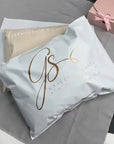 Custom poly mailers with stylish branding from Graceful Shape Boutique on a neutral background.