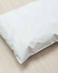 Wholesale poly mailer on a wooden surface, showcasing its durable and lightweight design for secure shipping.