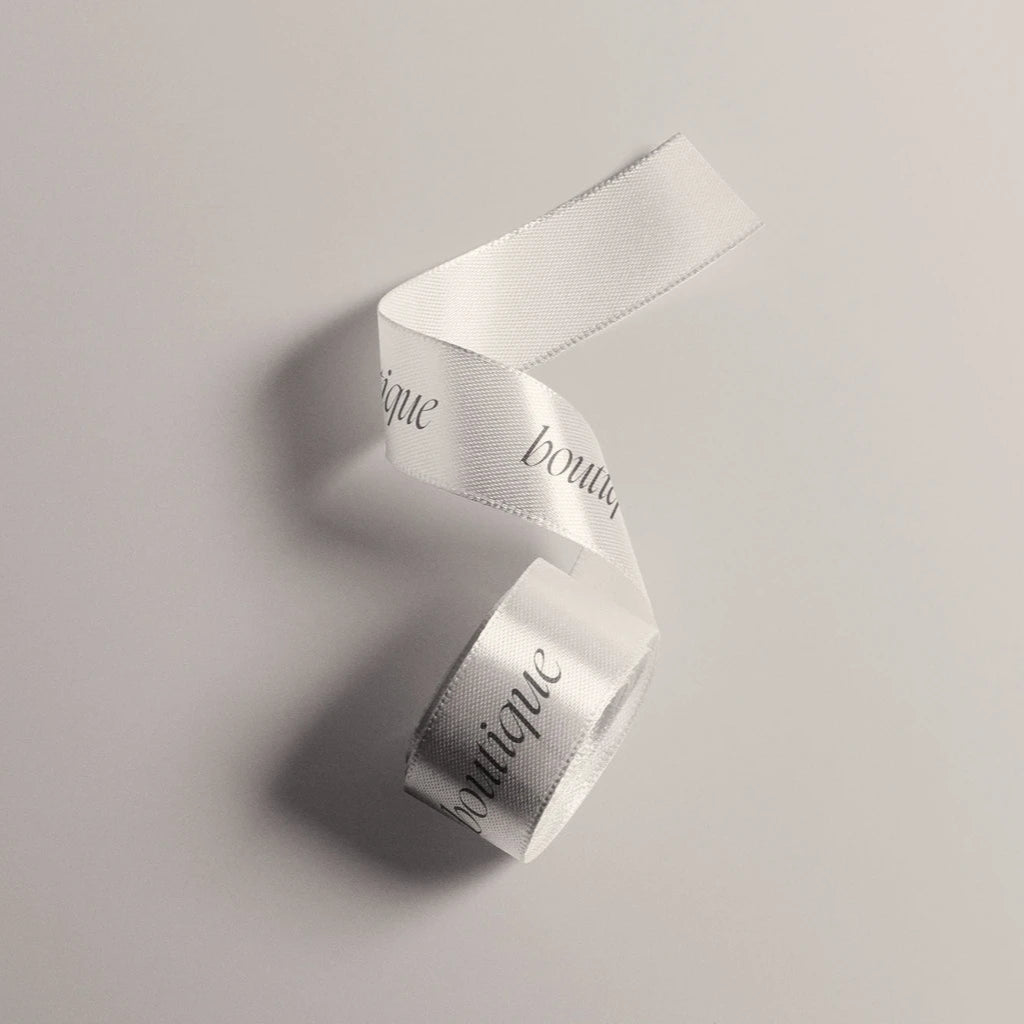 Custom satin ribbon with elegant printed text, ideal for gifts and event decorations.