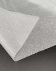 Close-up of eco-friendly bulk tissue paper, showcasing its soft, high-quality texture for packaging applications.
