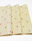 yellow tissue paper printed with flower logo