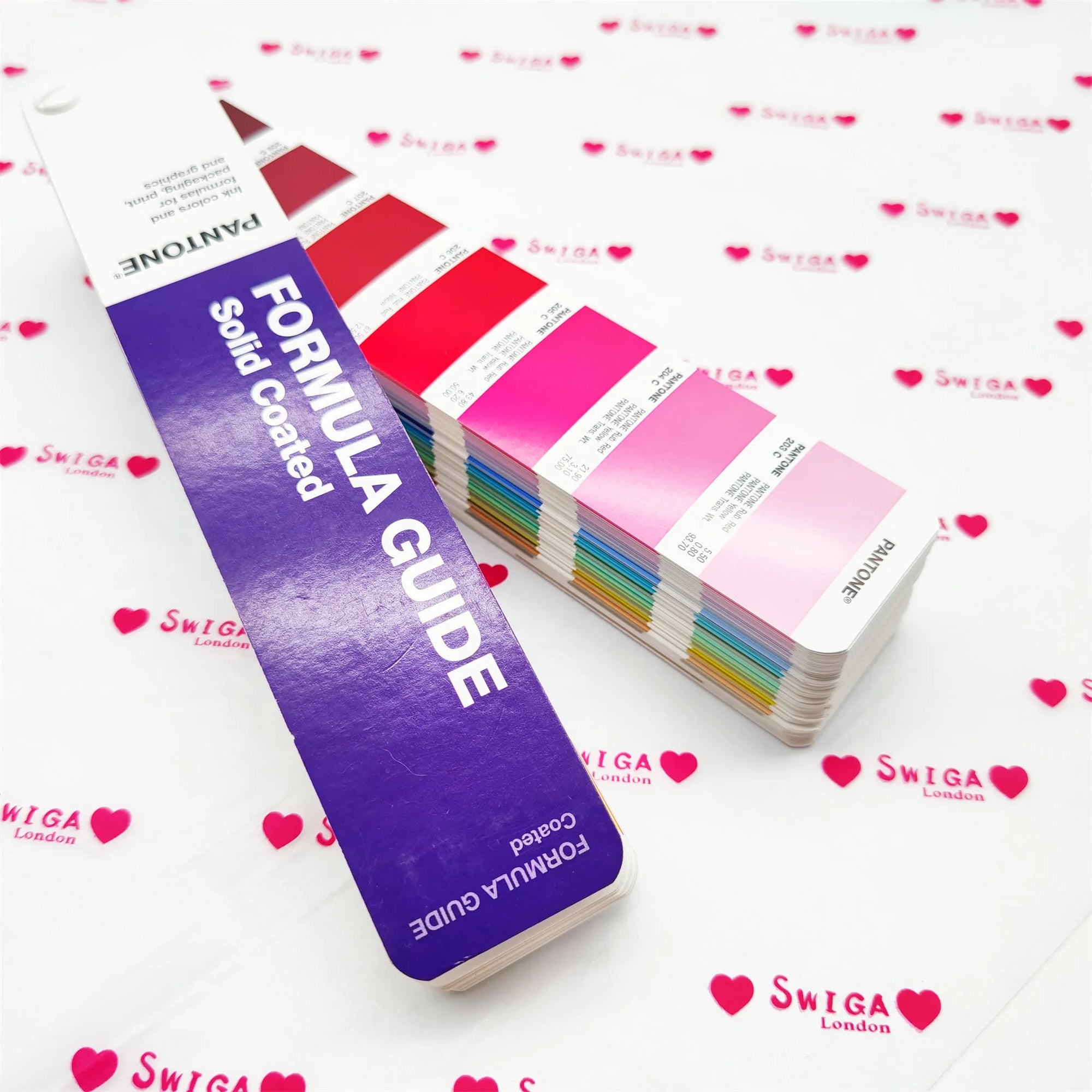 Paint swatch guide displaying various colors and shades on a patterned background.