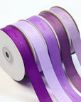 Custom grosgrain ribbon rolls in various shades of purple, showcasing distinctive ribbed texture for crafting and decoration.