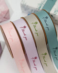 Custom polyester cotton ribbon in pastel colors with "Thank you" design, ideal for gift wrapping and decorating.