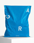 custom blue poly mailers with white logo