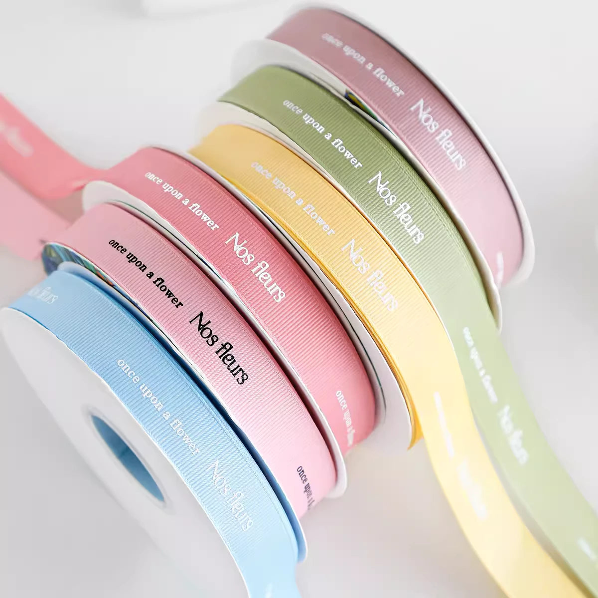 Custom Grosgrain Ribbons in pastel colors for crafting, packaging, and personalization, showcasing textured design.