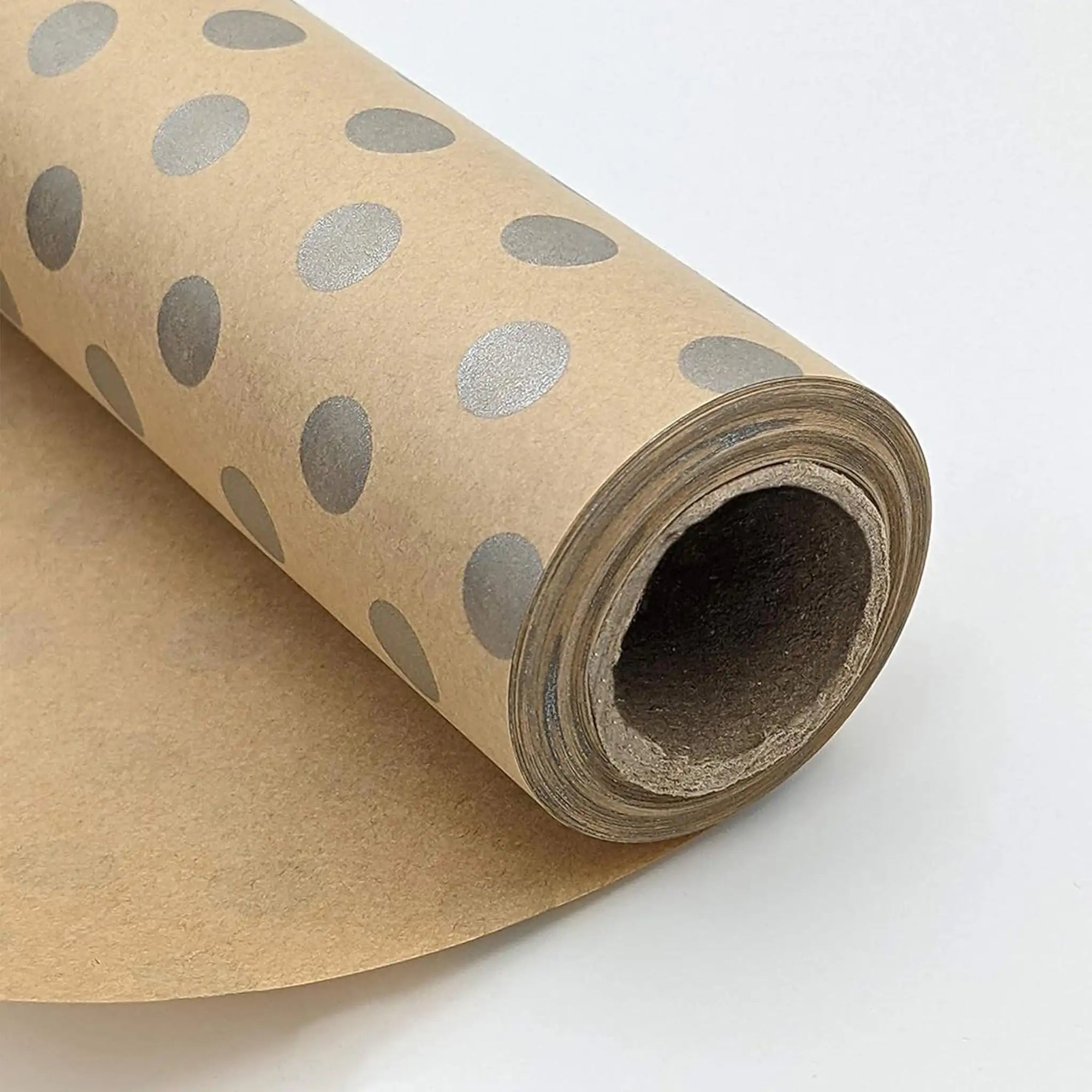 Custom tissue paper roll with silver polka dots, eco-friendly packaging solution for branding and style.