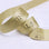 Custom metallic Lurex ribbon in gold with embossed text, ideal for elegant packaging and personalized event décor.