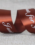 Custom satin ribbon in rich brown with "Just for you" message, perfect for elegant gift wrapping and decoration.