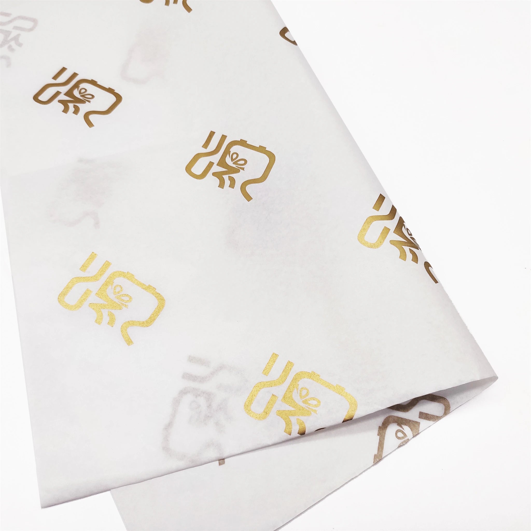 gold logo printed on 20lb tissue paper