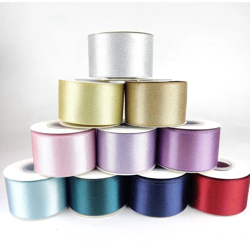 Custom Metallic Lurex Ribbon rolls in various colors, showcasing shine and elegance for festive projects and branding.