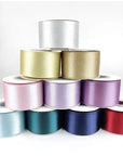 Custom Metallic Lurex Ribbon rolls in various colors, showcasing shine and elegance for festive projects and branding.